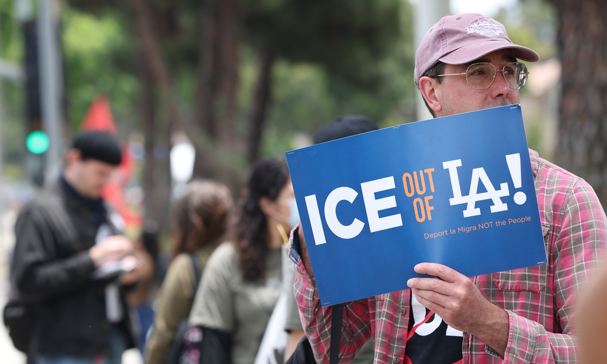 Protesters demonstrate outside Home Depot, on June 6, 2026, commemorating federal immigration raids and community protests one year ago in Paramount, California, US. Photo: VCG