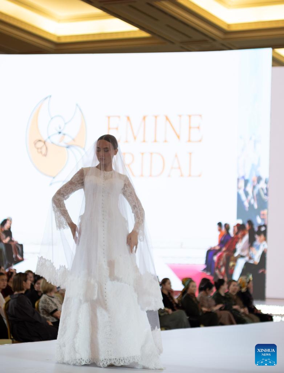 A model showcases a designer's creations at a fashion show during the Turkmen Textile Expo 2026 in Ashgabat, Turkmenistan, June 4, 2026. (Photo by Cui Jiaxin/Xinhua)