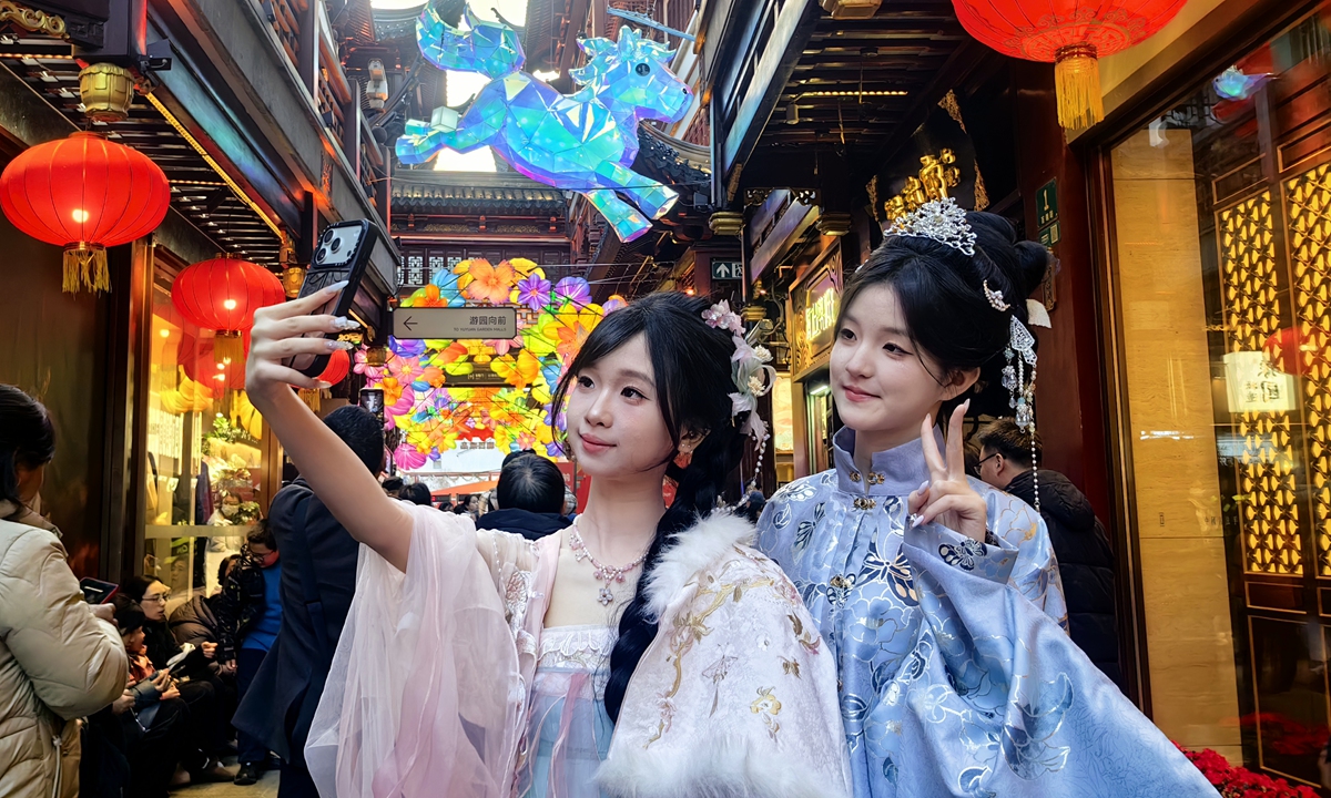 Two South Korean tourists wearing Hanfu, the traditional Chinese attire, pose for photos at Yu Garden in Shanghai on February 12, 2026. Photo: VCG