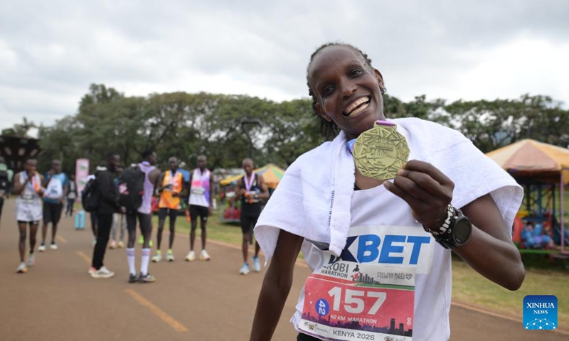 A lady poses with the medal after the Nairobi City Marathon in Nairobi, Kenya, June 7, 2026. (Xinhua/Yang Guang)