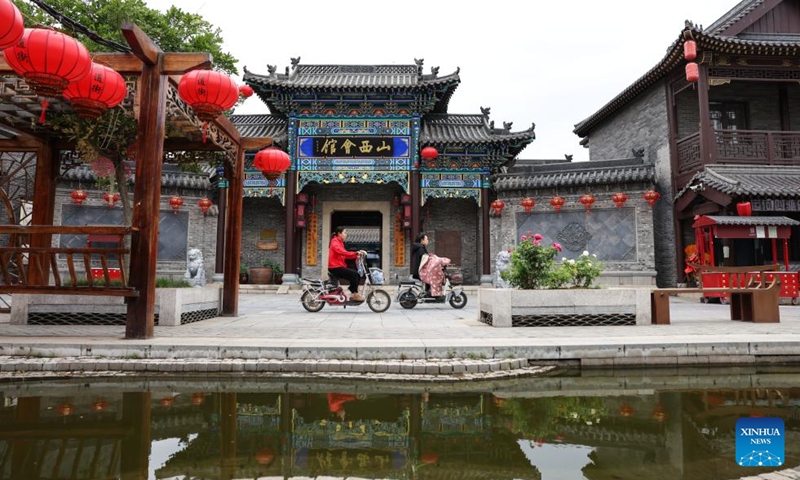 Residents ride electric bikes at the Erdaojie tourist spot along the Grand Canal in Gucheng County, Hengshui City, north China's Hebei Province, June 5, 2026.
Connecting the Chinese capital Beijing and Hangzhou in east China's Zhejiang Province, the Grand Canal, which was listed as a UNESCO World Heritage Site in 2014, is the world's longest artificial waterway.
Stretching approximately 75.1 kilometers, the Gucheng section of the Grand Canal has nourished the land along its banks for centuries and given rise to multiple provincial-level intangible cultural heritages.
In recent years, Gucheng County has boosted environmental conservation and cultural tourism development along the Grand Canal, transforming its banks into an ecological corridor with cultural richness. Photo: Xinhua