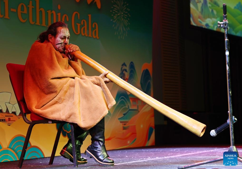 An actor plays the didgeridoo during a multicultural & multi-ethnic gala in Sydney, Australia, June 7, 2026. The event was held here ahead of the second International Day for Dialogue among Civilizations, a UN observance celebrated on June 10. (Xinhua/Gong Bing)