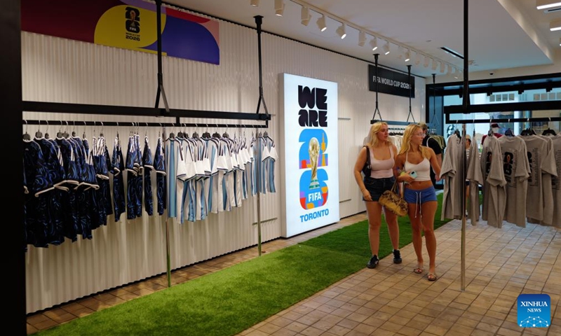 Customers shop at an official FIFA World Cup 2026 store in Toronto, Canada, on June 7, 2026. (Photo by Yang Shu/Xinhua)