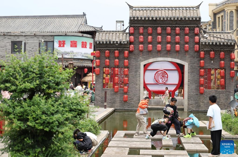 Children have fun at the Erdaojie tourist spot along the Grand Canal in Gucheng County, Hengshui City, north China's Hebei Province, June 5, 2026.
Connecting the Chinese capital Beijing and Hangzhou in east China's Zhejiang Province, the Grand Canal, which was listed as a UNESCO World Heritage Site in 2014, is the world's longest artificial waterway.
Stretching approximately 75.1 kilometers, the Gucheng section of the Grand Canal has nourished the land along its banks for centuries and given rise to multiple provincial-level intangible cultural heritages.
In recent years, Gucheng County has boosted environmental conservation and cultural tourism development along the Grand Canal, transforming its banks into an ecological corridor with cultural richness. Photo: Xinhua