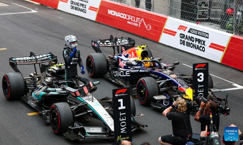 Mercedes' Kimi Antonelli (L) of Italy celebrates after the Formula One Monaco Grand Prix at Circuit de Monaco in Monte Carlo, Monaco, June 7, 2026. (Photo by Qian Jun/Xinhua)