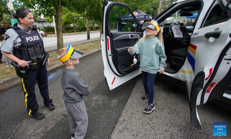 Children explore a police vehicle at a police station during the 2026 Doors Open event in Richmond, British Columbia, Canada, on June 6, 2026.
The two-day annual event kicked off on Saturday, offering the public behind-the-scenes access to cultural, historical and community sites across the city. Photo: Xinhua