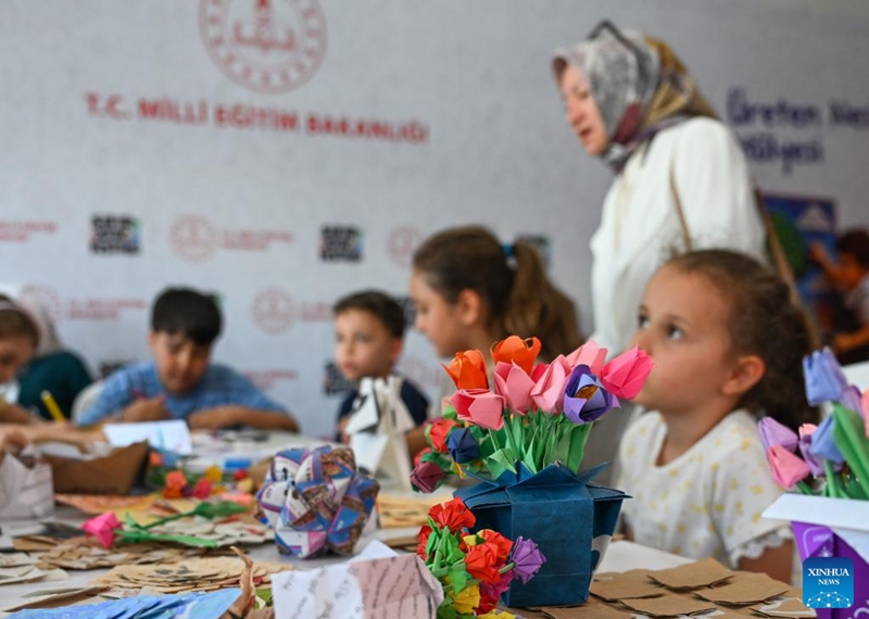 Children make handicrafts using recycled paper at the Zero Waste Festival in Istanbul, Türkiye, on June 6, 2026. The Zero Waste Festival is being held in Istanbul from June 4 to 7. (Xinhua/Liu Lei)
