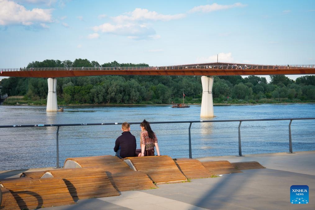 People relax along the Vistula River in Warsaw, Poland, June 8, 2026. (Photo: Xinhua)