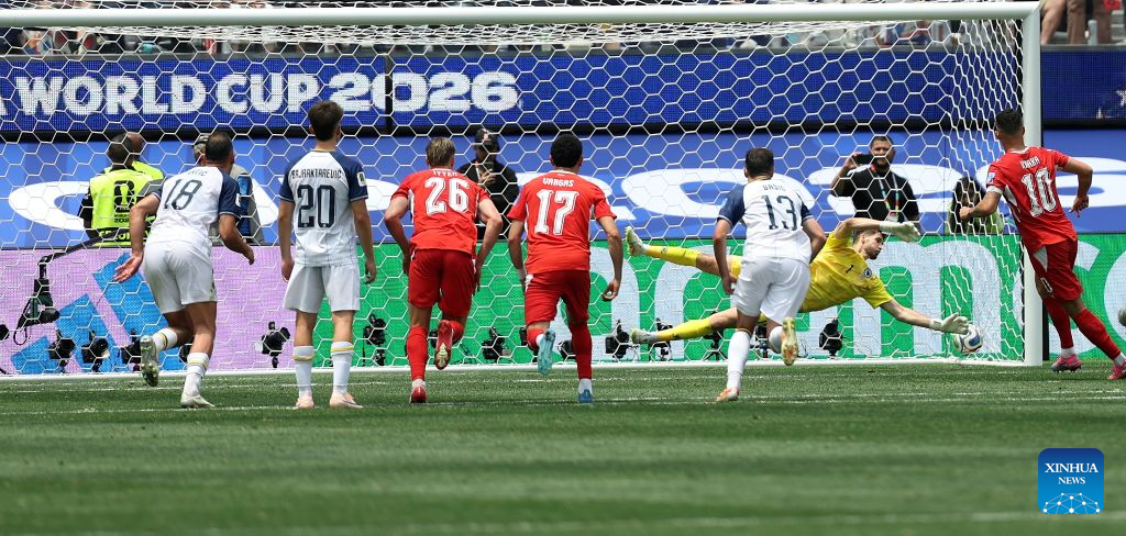Granit Xhaka (1st R) of Switzerland scores from a penalty kick during a group B match between Switzerland and Bosnia and Herzegovina at the 2026 FIFA World Cup at Los Angeles Stadium in Los Angeles, the United States, June 18, 2026. (Xinhua/Mao Siqian)