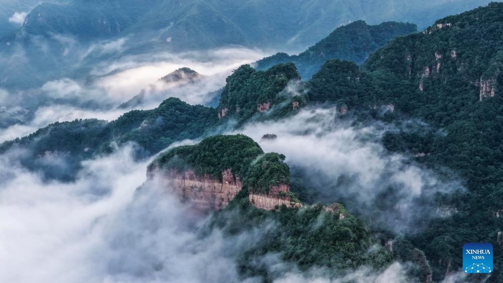 An aerial drone photo taken on June 9, 2026 shows the scenery of a sea of clouds at Xinglong Mountain scenic spot in Chengde City, north China's Hebei Province. (Photo: Xinhua)