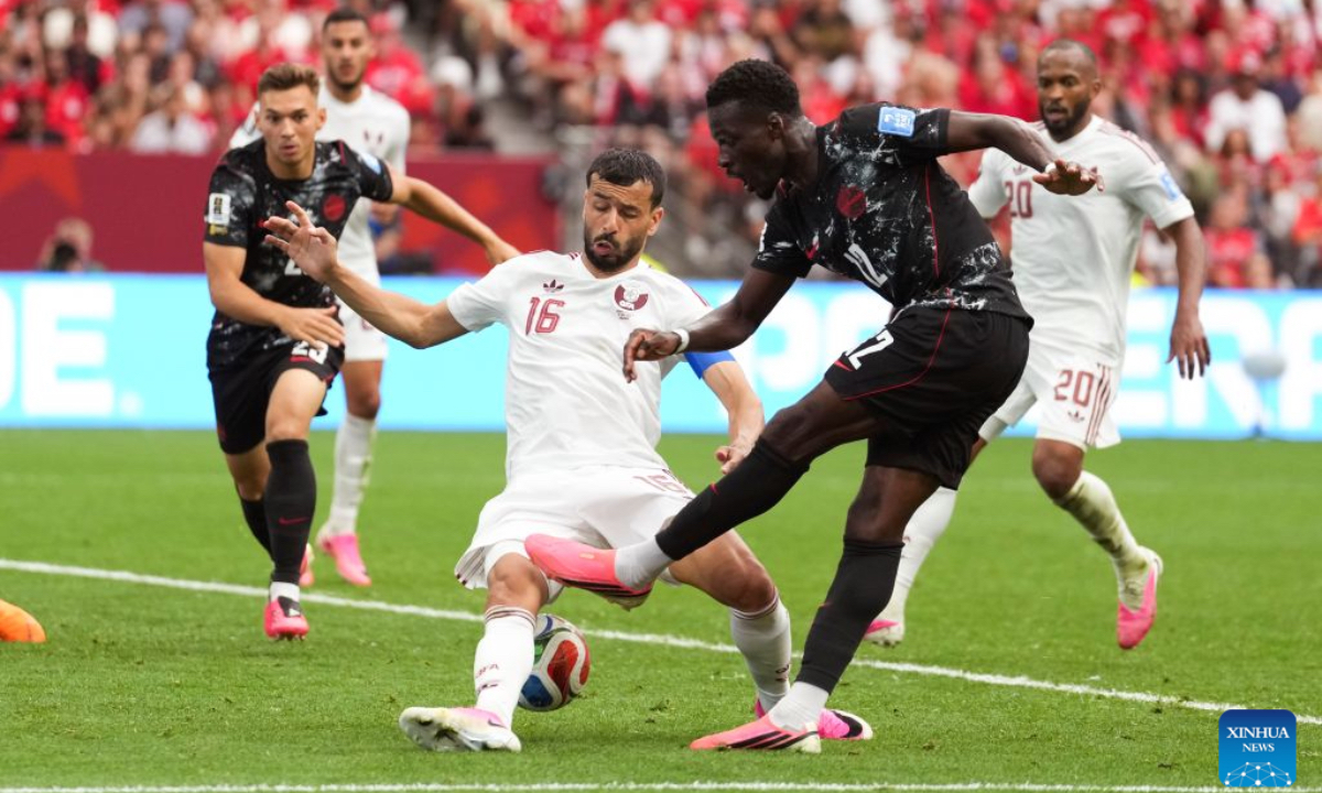 Tani Oluwaseyi (R, front) of Canada shoots during the group B match between Canada and Qatar at the 2026 FIFA World Cup at BC Place Vancouver in Vancouver, Canada, June 18, 2026. (Xinhua/Meng Yongmin)