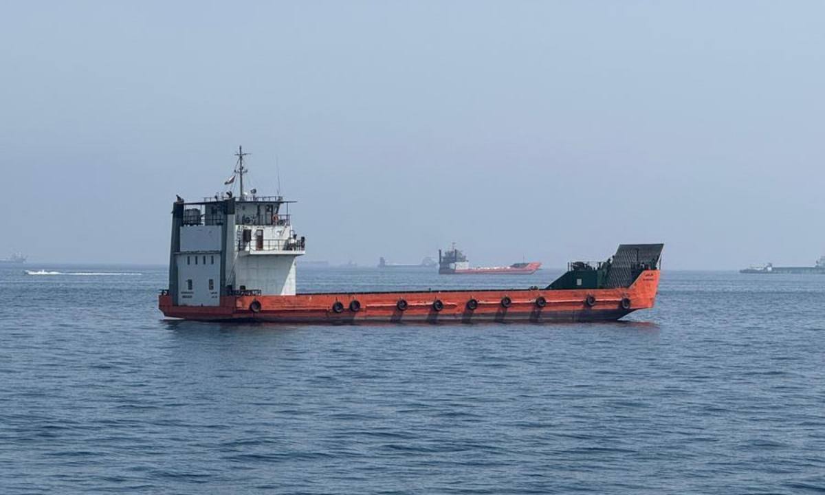 This photo taken with a mobile phone shows merchant vessels stranded in the waters of the Strait of Hormuz, near Khasab, a small town in northern Oman, May 29, 2026. (Xinhua/Wen Xinnian)