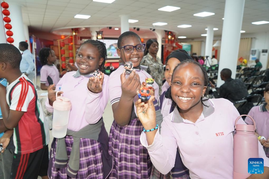 Students display panda-themed artworks they have created during the opening event of the Hello Nigeria 2026 Panda Painting Interactive Experience Exhibition at the China Cultural Center in Abuja, Nigeria, on June 8, 2026. More than 200 students and teachers from six local international schools participated in the opening event on Monday. (Photo: Xinhua)