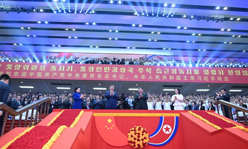 Xi Jinping, general secretary of the Communist Party of China Central Committee and Chinese president, and his wife Peng Liyuan, along with Kim Jong Un, general secretary of the Workers' Party of Korea and president of the State Affairs of the Democratic People's Republic of Korea (DPRK), and Kim's wife Ri Sol Ju, watch an artistic performance at the Pyongyang Gymnasium in Pyongyang, the DPRK, June 8, 2026. (Photo: Xinhua)