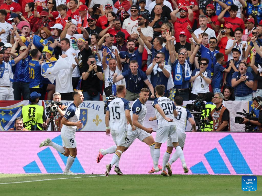 Jovo Lukic (C) of Bosnia and Herzegovina celebrates with teammates after scoring during the group B match between Canada and Bosnia and Herzegovina at the 2026 FIFA World Cup at Toronto Stadium in Toronto, Canada, June 12, 2026. (Photo by Zou Zheng/Xinhua)