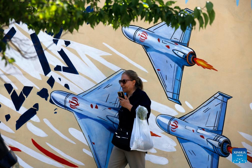 A woman walks on a street in Tehran, Iran, June 8, 2026. (Photo: Xinhua)