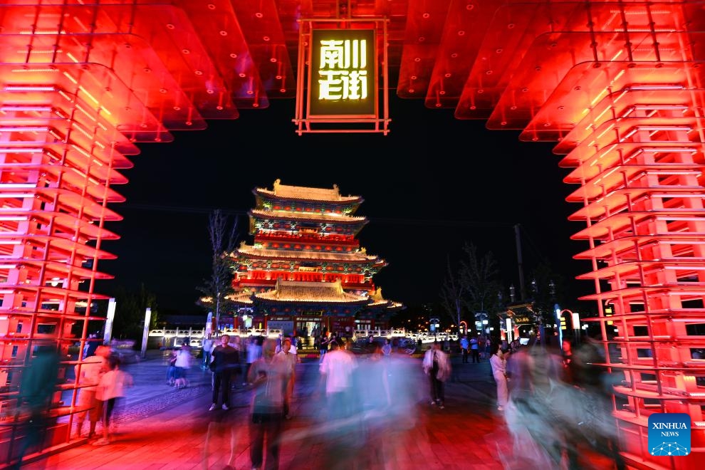 People visit the Nanchuan Old Street along the Cangzhou section of the Grand Canal in Cangzhou, north China's Hebei Province, June 5, 2026. Connecting Beijing, capital of China, and Hangzhou in east China's Zhejiang Province, the Grand Canal is the world's longest artificial waterway. The 216-km Cangzhou section of the Grand Canal runs through the city. In recent years, Cangzhou has made efforts to build the Grand Canal cultural belt, promoting the integrated development of cultural and tourism industries. (Photo: Xinhua)