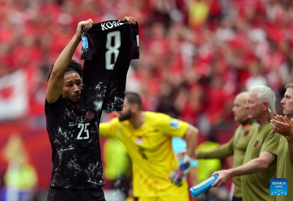 Nathan Saliba of Canada holds up the shirt of injured player Ismael Kone as he celebrates his goal during the group B match between Canada and Qatar at the 2026 FIFA World Cup at BC Place Vancouver in Vancouver, Canada, June 18, 2026. (Xinhua/Meng Yongmin)