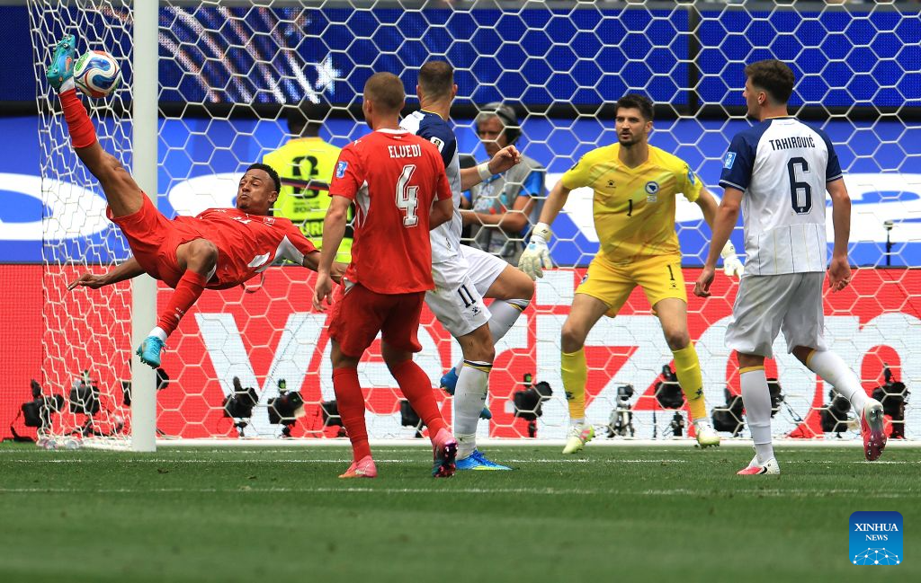 Dan Ndoye (1st L) of Switzerland shoots during a group B match between Switzerland and Bosnia and Herzegovina at the 2026 FIFA World Cup at Los Angeles Stadium in Los Angeles, the United States, June 18, 2026. (Xinhua/Mao Siqian)