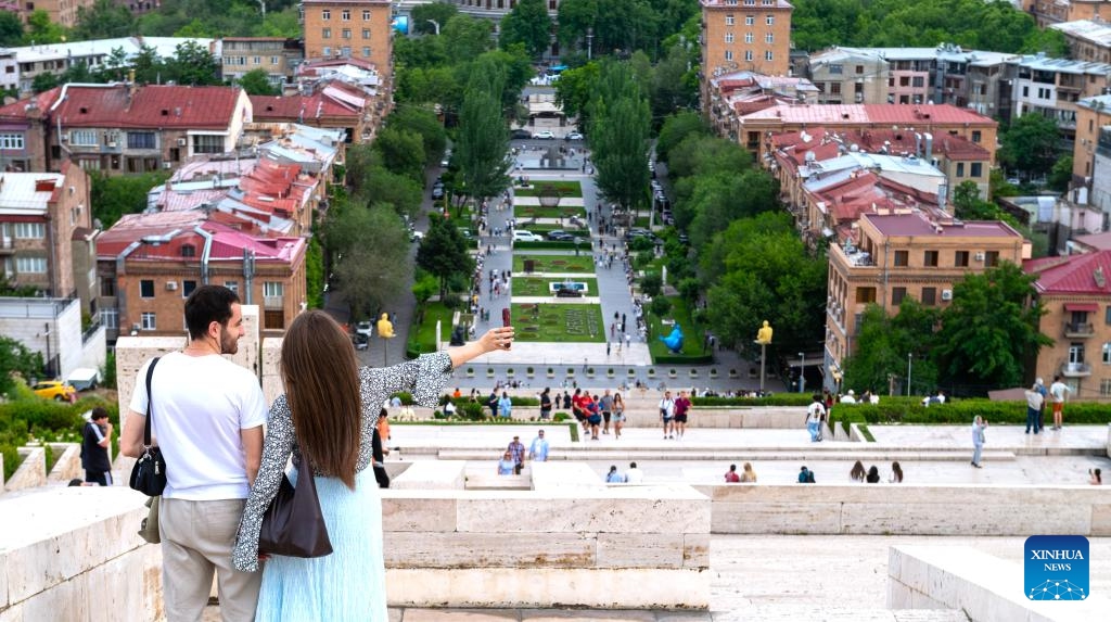 Visitors enjoy themselves at the Cascade Complex in Yerevan, Armenia, June 8, 2026. The Cascade Complex is a landmark in the heart of Yerevan. Visitors can enjoy panoramic views of the city from its top. (Photo: Xinhua)