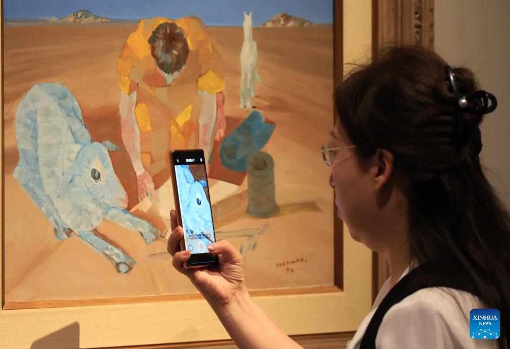 A woman visits an art exhibition titled The Brazil of Portinari at the National Museum of China in Beijing, capital of China, June 9, 2026. The exhibition showcased 56 paintings of the renowned Brazilian artist Candido Portinari. (Photo: Xinhua)