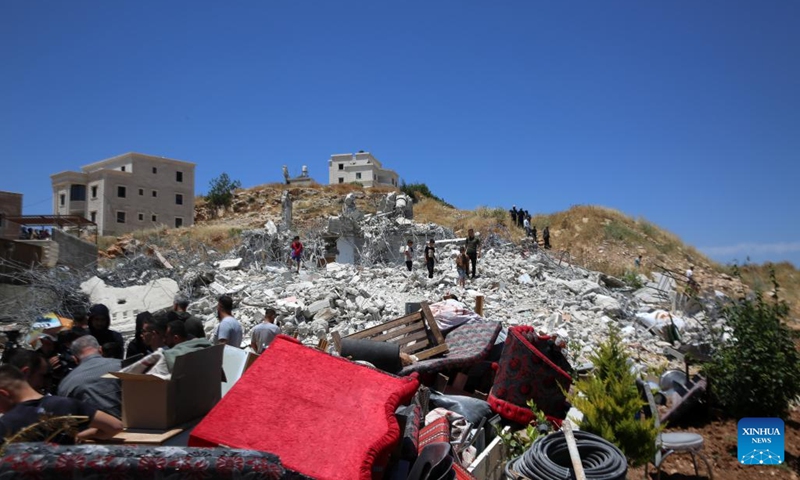 Palestinians inspect the rubble after Israeli excavators demolished a Palestinian home and a carpentry workshop in the Khirbet Qalqas area, south of Hebron, in the West Bank, on June 8, 2026. (Photo: Xinhua)