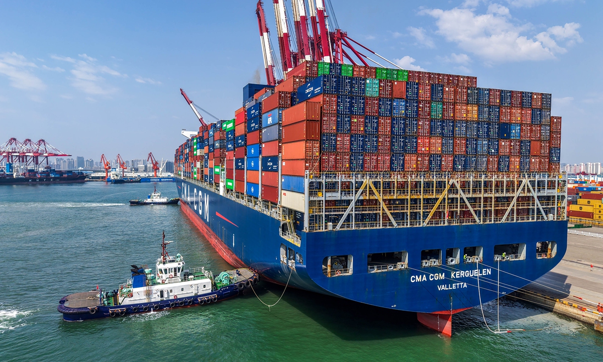 Tugboats assist a container ship into dock at Qingdao Port in Qingdao, East China's Shandong Province on June 9, 2026. Photo: VCG