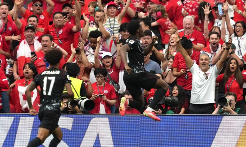 Jonathan David (R) of Canada celebrates his goal during the group B match between Canada and Qatar at the 2026 FIFA World Cup at BC Place Vancouver in Vancouver, Canada, June 18, 2026. (Xinhua/Meng Yongmin)