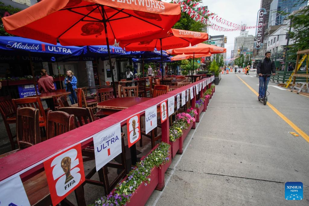 A restaurant patio decorated with FIFA World Cup tournament branding is seen along a closed street in downtown Vancouver, British Columbia, Canada, June 9, 2026. Vancouver is making final preparations to welcome fans from around the world for the 2026 FIFA World Cup. (Photo: Xinhua)