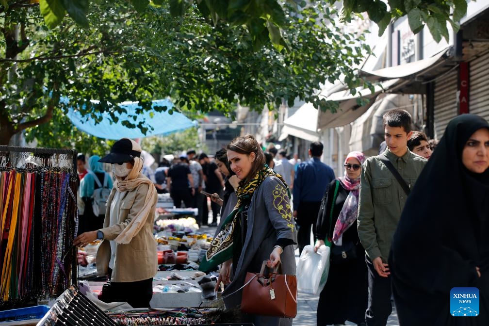 People shop on a street in Tehran, Iran, June 8, 2026. (Photo: Xinhua)