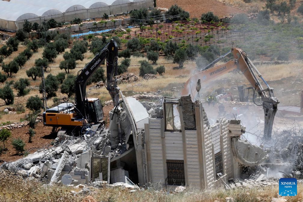 Israeli excavators demolish a Palestinian home and a carpentry workshop in the Khirbet Qalqas area, south of Hebron, in the West Bank, on June 8, 2026. (Photo: Xinhua)