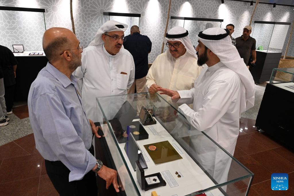 People visit the third International Paper and Metal Coin Exhibition at the Kuwait National Museum in Kuwait City, Kuwait, June 8, 2026. (Photo: Xinhua)