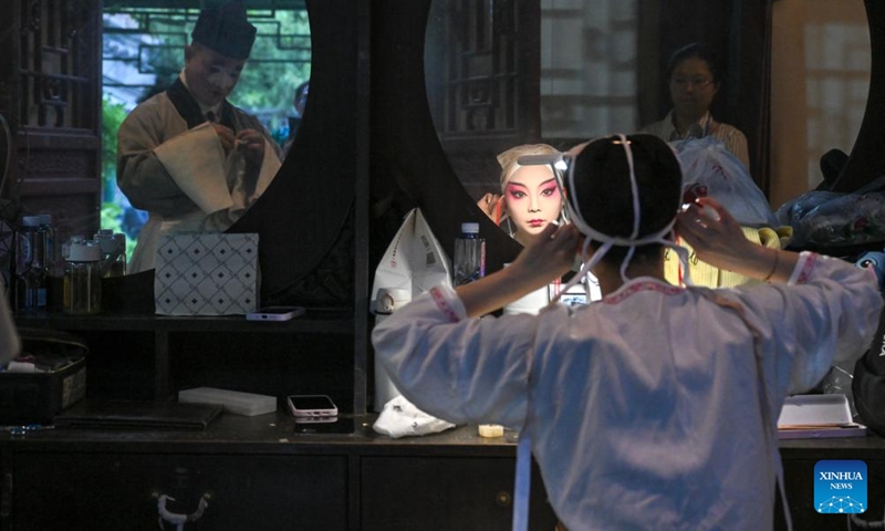 Actors prepare for a performance at the Grand Theatre of Prince Kung's Palace Museum in Beijing, capital of China, June 9, 2026. The 19th Echoes of Classics: Prince Kung's Palace Museum Intangible Cultural Heritage Performance Season kicked off at the museum's Grand Theatre on Tuesday. Featuring three Kunqu Opera performances and three guqin concerts, the event, which runs until June 14, stages the charm of intangible cultural heritage in ancient architectural sites. (Photo: Xinhua)