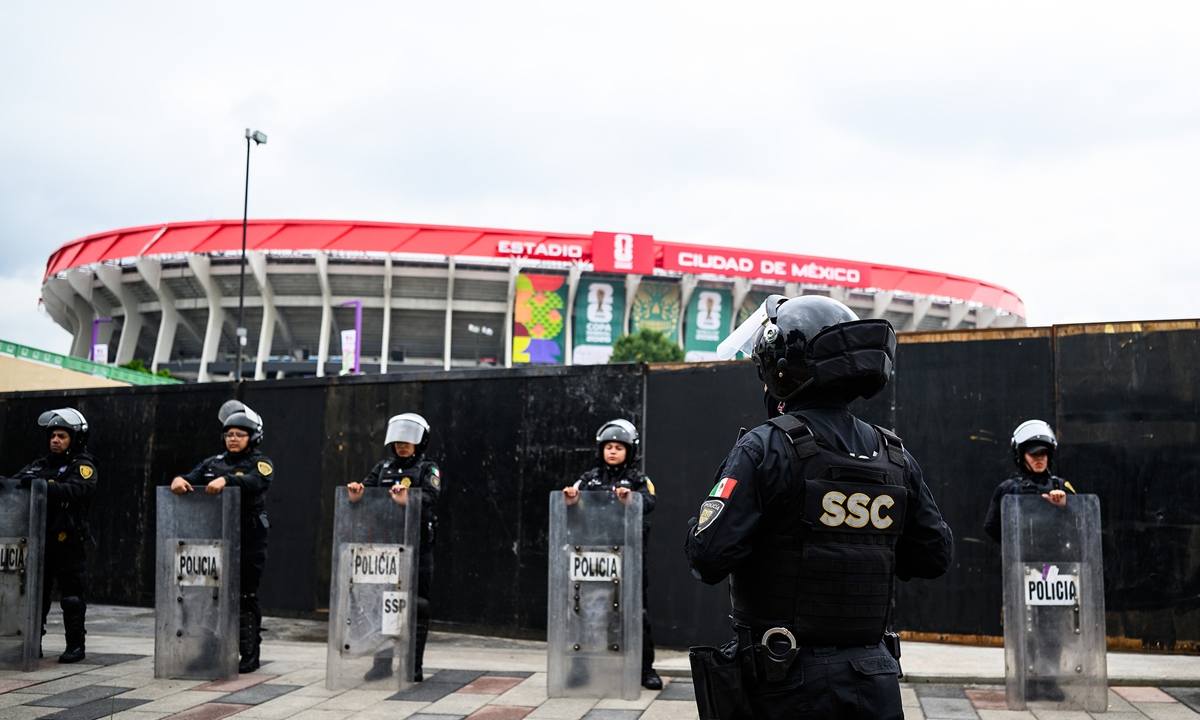 Police officers stand in front of the Mexico City's Azteca Stadium. The opening match of the 2026 World Cup will take place in Mexico City on June 11. Photo: VCG