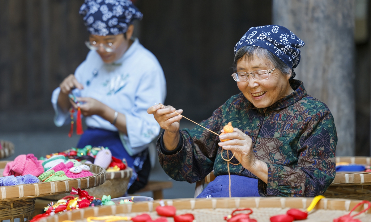 Villagers handcraft traditional sachets using colorful silk threads and aromatic medicinal herbs for the upcoming Dragon Boat Festival in Huangshan, East China's Anhui Province on June 10, 2026. Carefully stitched by hand, these sachets embody heartfelt wishes for peace, good health, and well-being, reflecting the rich cultural traditions associated with the festival. Photo: VCG