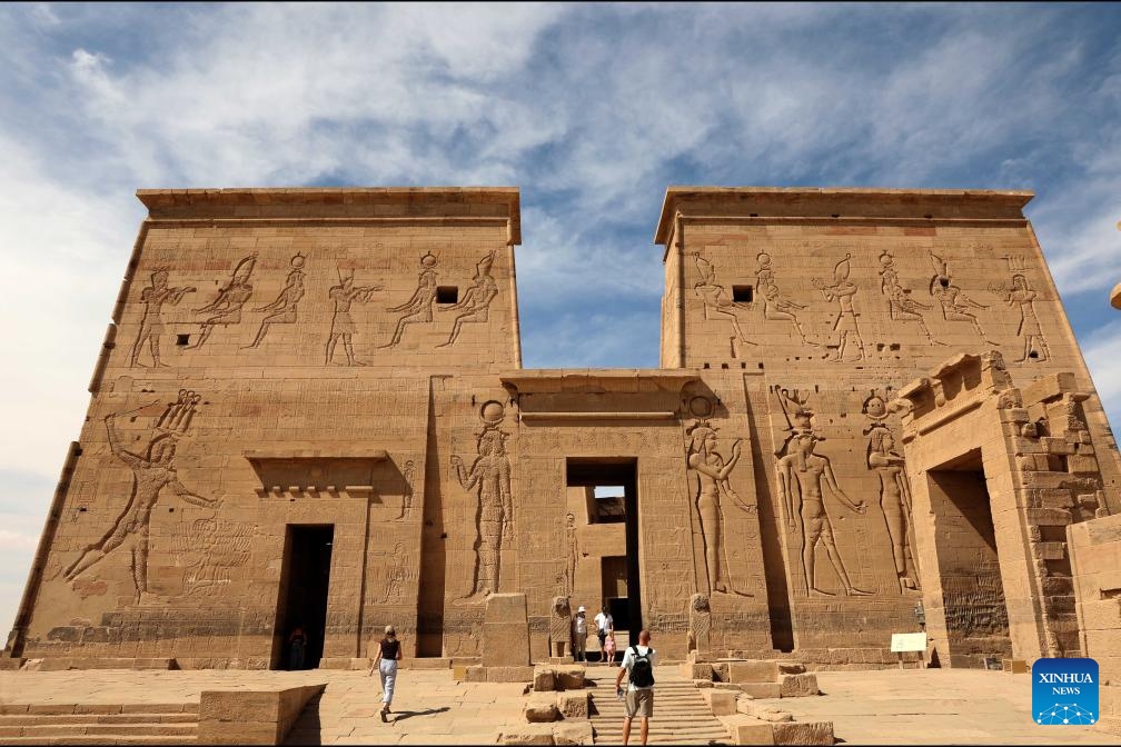 Tourists visit the Philae Temple complex in Aswan, Egypt, June 10, 2026. Egypt's tourism revenues rose 14.9 percent year-on-year to 14.4 billion U.S. dollars during the first nine months of the 2025/26 fiscal year, according to a government statement issued on Wednesday. (Photo: Xinhua)