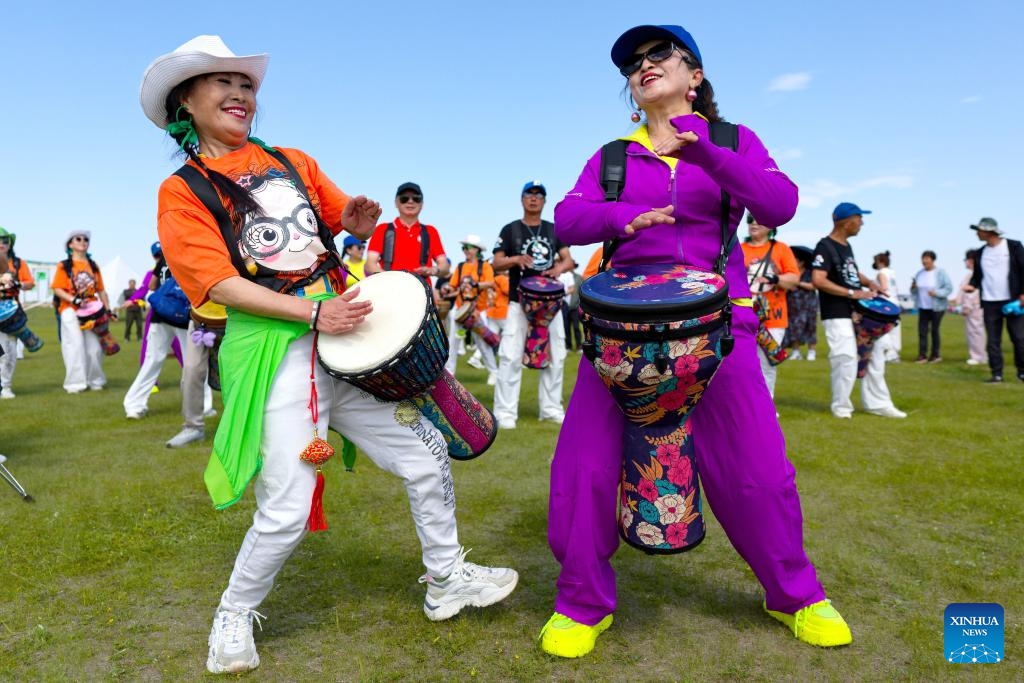 Visitors perform during the Kumule Festival at a grassland in Qiqihar, northeast China's Heilongjiang Province, June 10, 2026. The 39th Kumule Festival, a traditional festival of Daur ethnic group, opened here on Wednesday. The three-day festival will offer people with grassland concerts, bonfire gatherings and other various events to show the culture and customs of Daur people. (Photo: Xinhua)