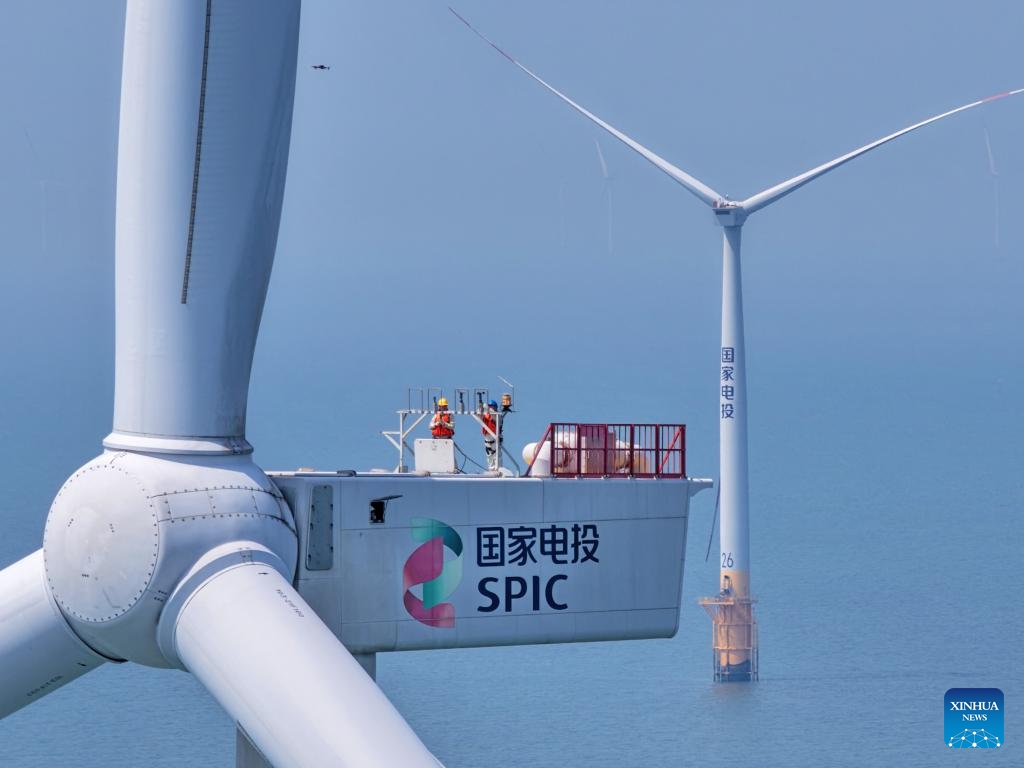 A drone photo taken on June 10, 2026 shows maintenance workers conducting routine maintenance on a wind turbine at an offshore wind farm in Rudong, east China's Jiangsu Province. Recently, staff members have carried out maintenance of offshore wind turbines and step-up substations at two offshore wind farms, so as to ensure a stable and safe power supply during the incoming high temperature period. (Photo: Xinhua)