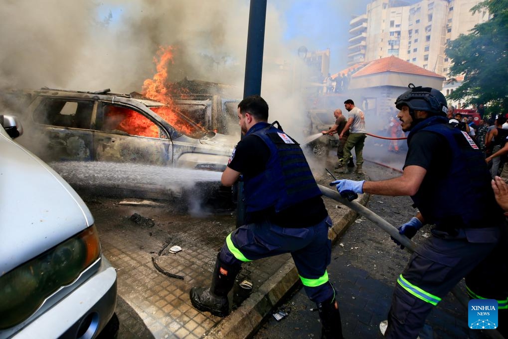Photo taken on June 10, 2026 shows people putting out fire after an Israeli airstrike in Sidon, south Lebanon. Israeli attacks on southern Lebanon killed at least 18 people and injured several others on Wednesday, according to Lebanon's National News Agency, civil defense and health authorities. (Photo: Xinhua)