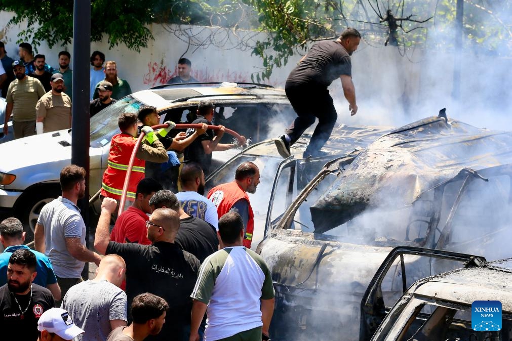 Photo taken on June 10, 2026 shows people putting out fire after an Israeli airstrike in Sidon, south Lebanon. Israeli attacks on southern Lebanon killed at least 18 people and injured several others on Wednesday, according to Lebanon's National News Agency, civil defense and health authorities. (Photo: Xinhua)