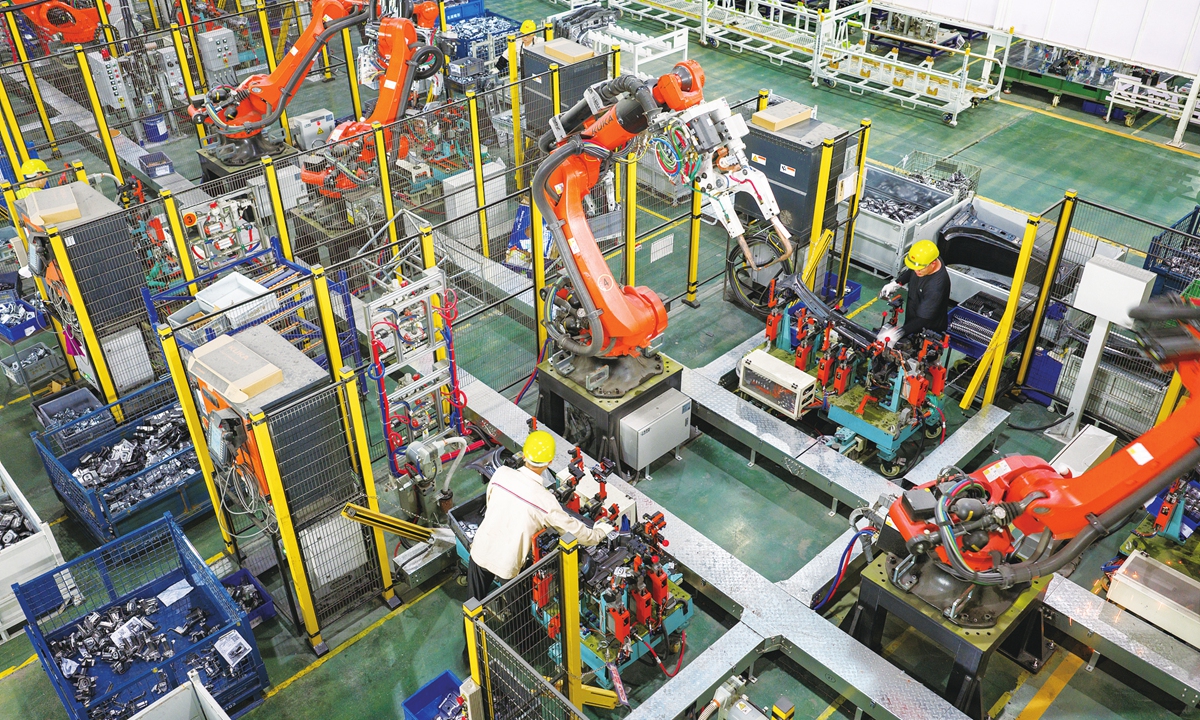 Industrial robot production lines run at full capacity at a new-energy vehicle parts company in Jinhua, East China's Zhejiang Province on June 22, 2026. Photo: VCG