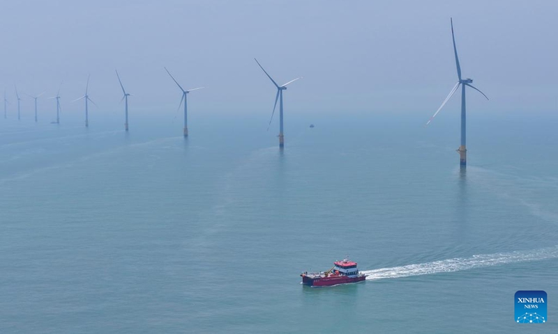 An aerial drone photo taken on June 10, 2026 shows a maintenance vessel sailing at an offshore wind farm in Rudong, east China's Jiangsu Province. (Photo: Xinhua)