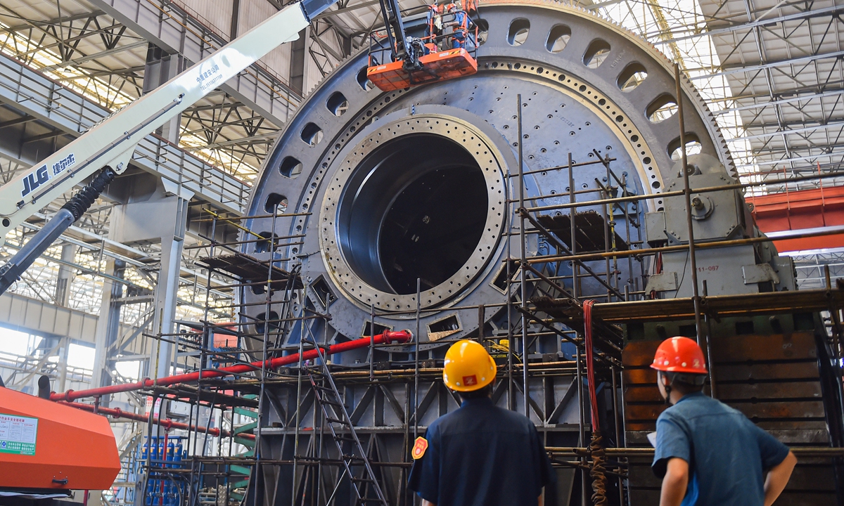 Workers assemble an ultra-large mining mill with a diameter exceeding 8 meters at the CITIC Heavy Industries workshop in Jianxi District, Luoyang, Henan Province, on June 11, 2026. The product is part of an overseas export order. Photo: VCG