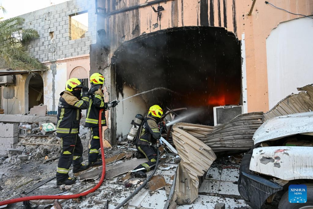Members of Bahrain's Civil Defense extinguish a fire caused by falling debris from intercepted Iranian drones in Hamad Town, Bahrain, on June 11, 2026. An 11-year-old girl sustained minor injuries after debris from intercepted Iranian drones fell in Bahrain, damaging some houses, Bahrain's Interior Ministry said Thursday.

Iran's Islamic Revolution Guard Corps said Thursday it had launched attacks on U.S. military bases in Jordan, Kuwait and Bahrain in retaliation for U.S. strikes. (Bahrain's Interior Ministry/Handout via Xinhua)