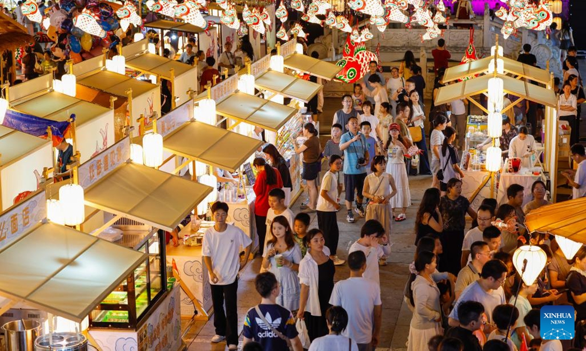 Tourists visit a night market at Huizhou Ancient City in Huangshan, east China's Anhui Province, Oct. 2, 2025. (Photo by Shi Yalei/Xinhua)