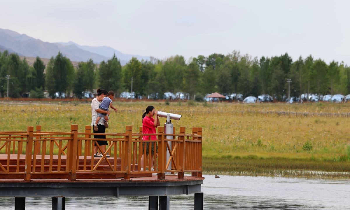 Visitors enjoy the scenery of Bortala River National Wetland Park in Wenquan county, Bortala, Northwest China's Xinjiang Uygur Autonomous Region on August 15, 2025. Photo: VCG