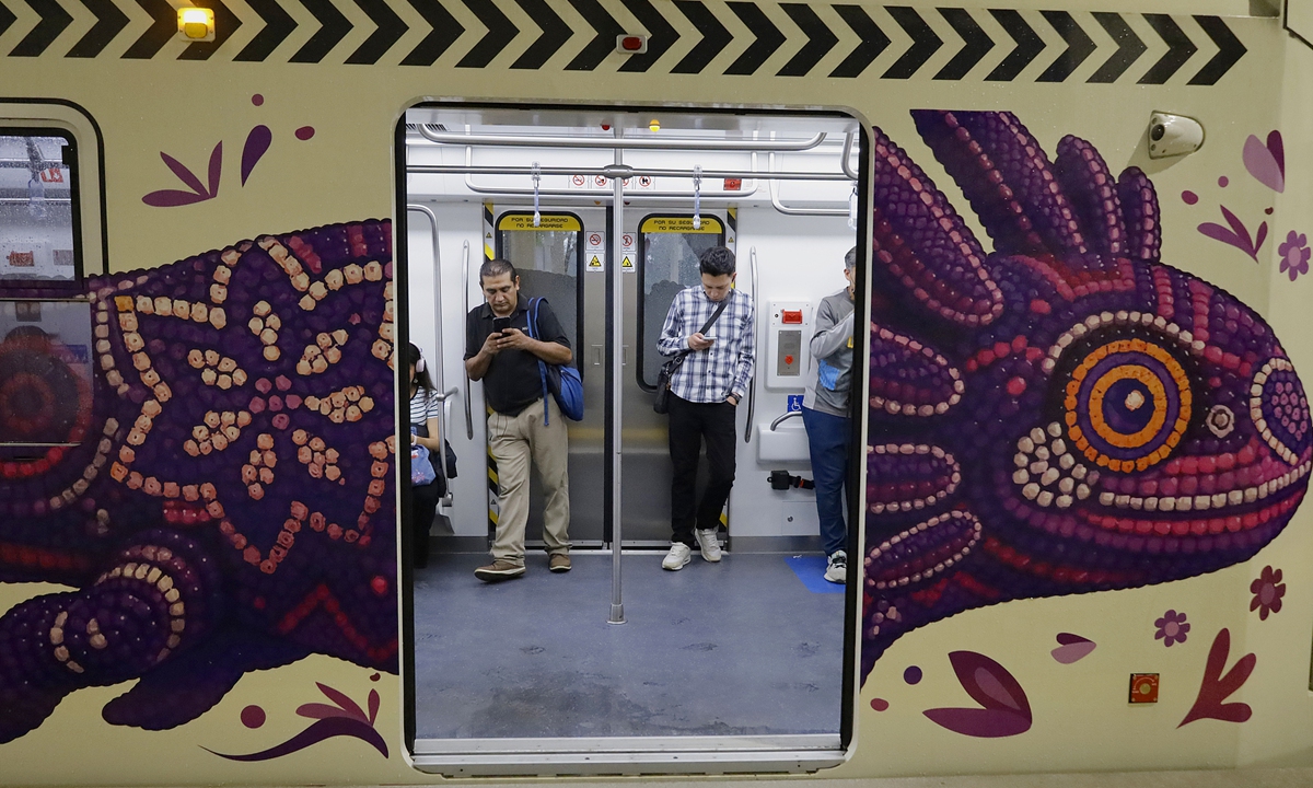 A China-made light rail train decorated with an axolotl pattern is spotted at the Taxquena station in Mexico City, Mexico, on May 19, 2026.