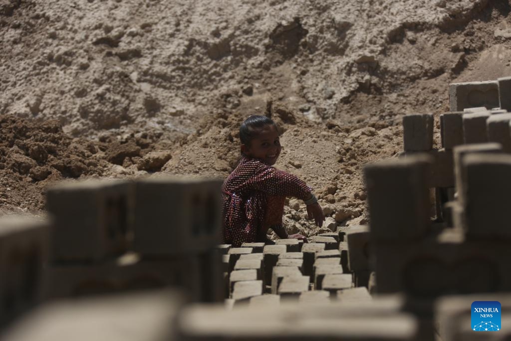 An Afghan child works at a brick factory in Kabul, Afghanistan, June 9, 2026. As the international community observes the World Day Against Child Labor on June 12, millions of Afghan children are leaving school to work in brick kilns, markets, construction sites, and workshops, driven by grinding poverty that has upended families across the poverty-stricken country. (Photo by Saifurahman Safi/Xinhua)