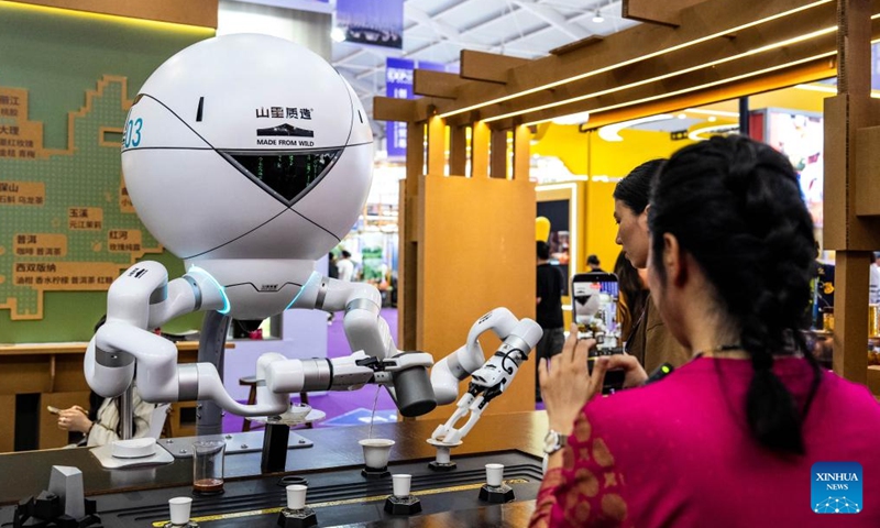 A robot makes tea at the 10th China-South Asia Expo in Kunming, southwest China's Yunnan Province, June 12, 2026. The 10th China-South Asia Expo kicked off on Thursday in Kunming City, capital of southwest China's Yunnan Province. The event has put an emphasis on enhancing regional trade and industrial cooperation under the theme Solidarity and Coordination for Common Development. (Xinhua/Hu Chao)