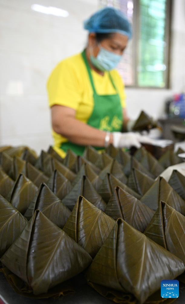 Fenghui zongzi are seen at a workshop in Wenchang, south China's Hainan Province, June 12, 2026. Fenghui zongzi, which are sticky rice dumplings originated in Fenghui Village of Wenchang, stand as a representative of local zongzi varieties. With the Dragon Boat Festival approaching, local producers of Fenghui zongzi are ramping up production to meet market demand. (Xinhua/Pu Xiaoxu)